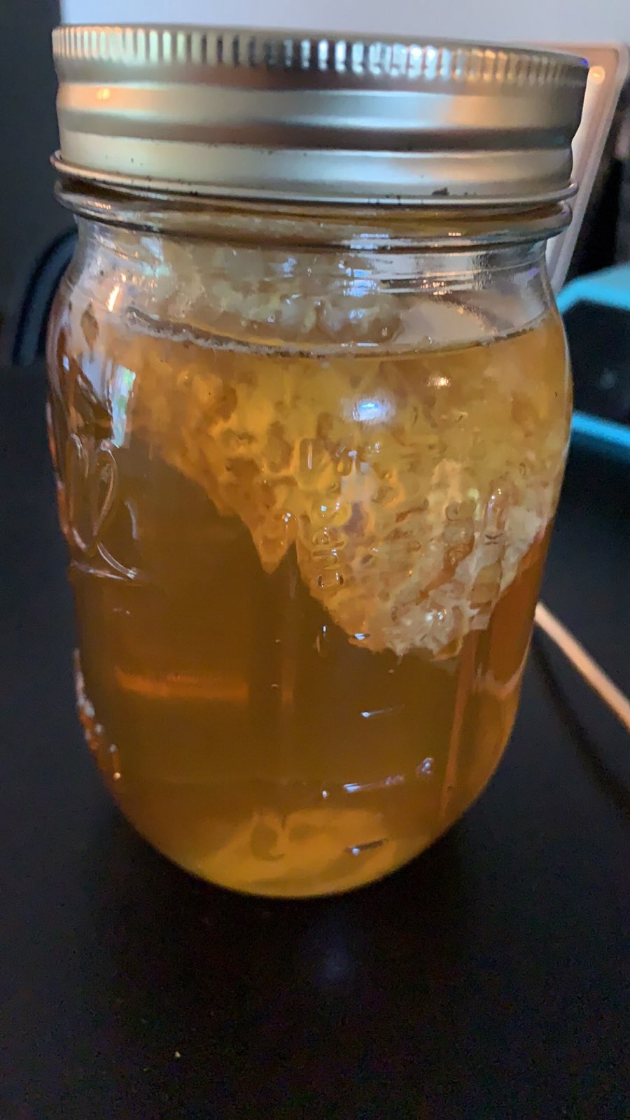 Chunk honey: liquid honey with comb in the jar in Central PA